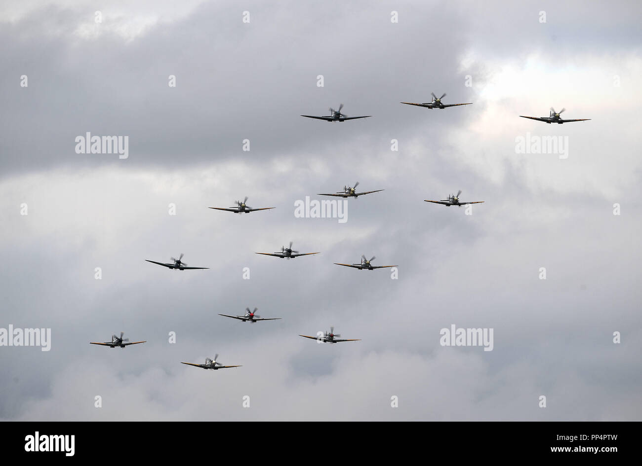 Supermarine Spitfires fly in formation during the Battle of Britain Air Show at the Imperial War Museum in Duxford, Cambridgeshire. Stock Photo