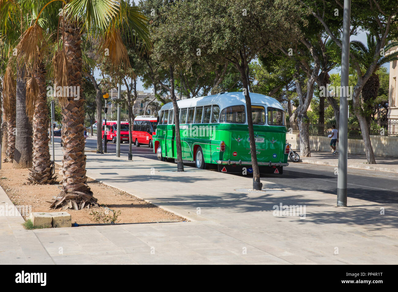 City Valleta, Malta, Europe. City streets and  urban view. Green bus, peoples and architecture. Travel photo 2018 september. Stock Photo