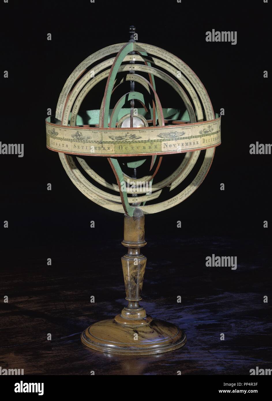 Armillary sphere,model of objects in the sky (on the celestial sphere), consisting of a spherical framework of rings, centred on Earth or the Sun, that represent lines of celestial longitude and latitude and other astronomically important features - 1751. Location: UNIVERSIDAD BIBLIOTECA. SALAMANCA. SPAIN. Stock Photo