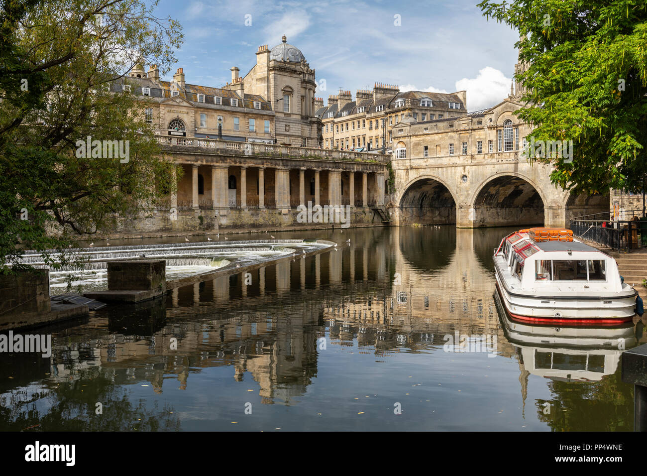 Pulteney Bridge and weir, Grand Parade and riverside vaults all seen with reflections in the River Avon, City of Bath, Somerset, England, UK Stock Photo
