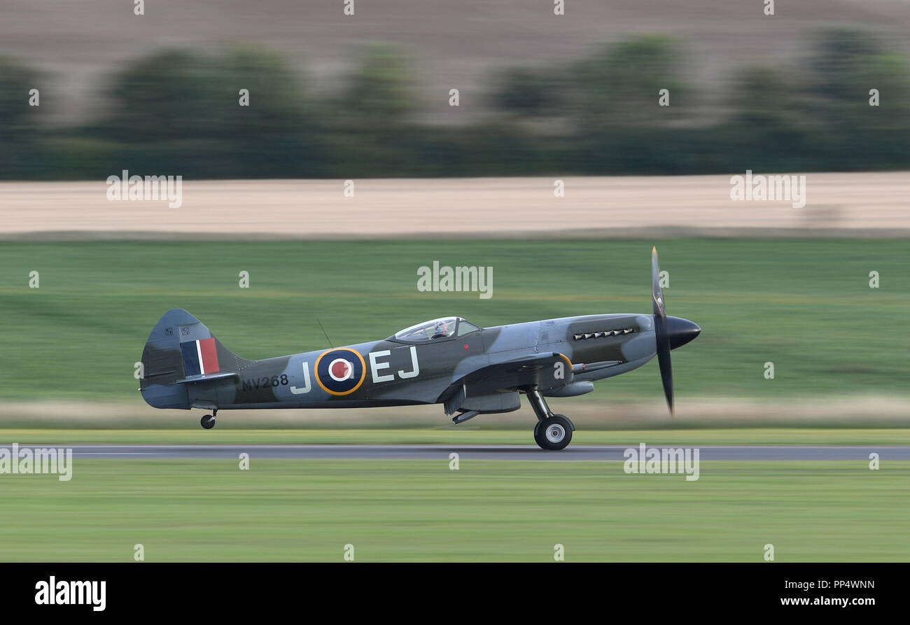 A Supermarine Spitfire touches down on the runway during the Battle of Britain Air Show at the Imperial War Museum in Duxford, Cambridgeshire. Stock Photo