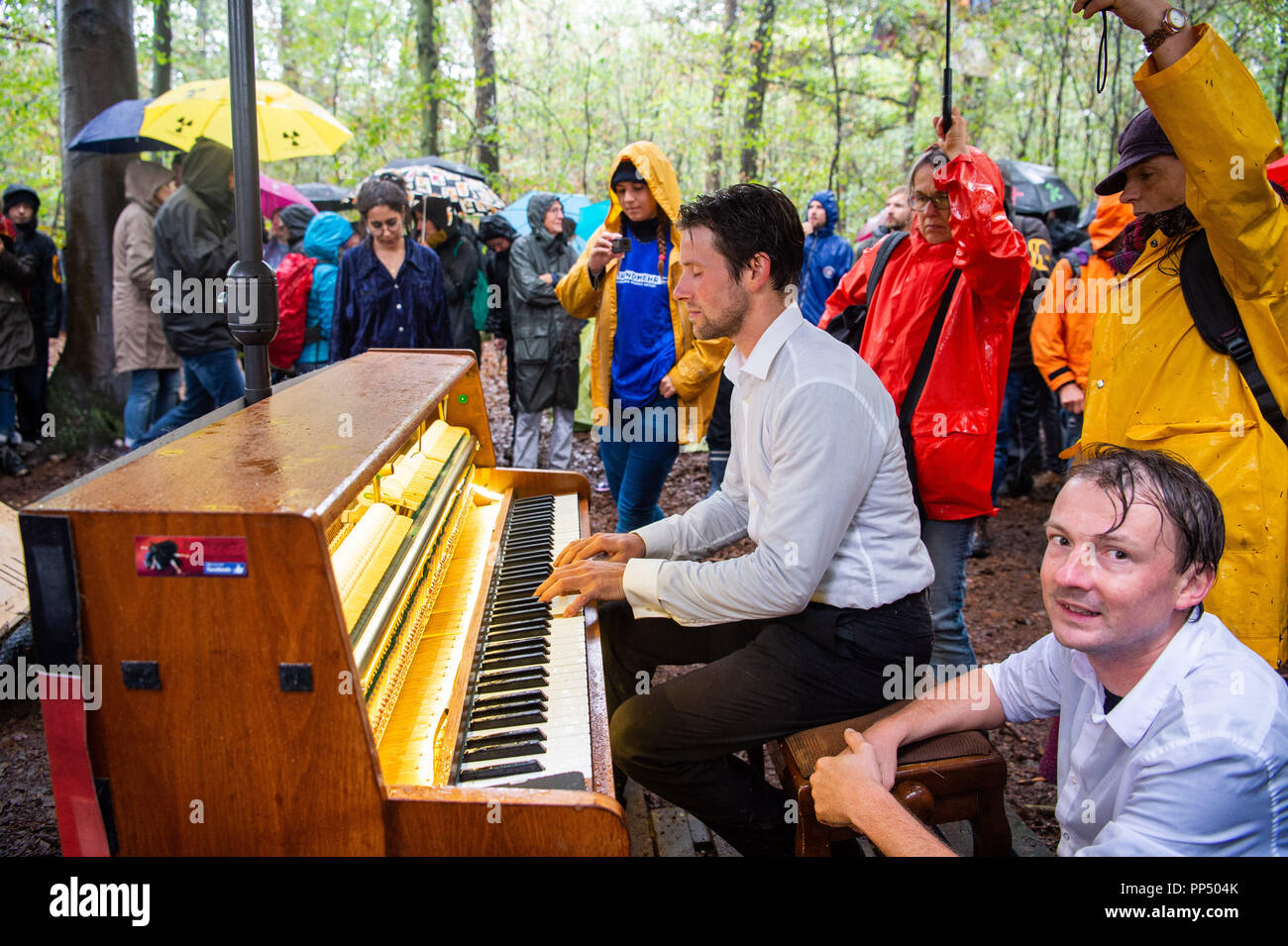Kerpen Germany 23rd September 18 A Participant Of The Demonstration Against The Clearing Of The Hambach Forest Sits In The Forest And Plays The Piano In The Rain Photo Christophe Gateau Dpa Credit