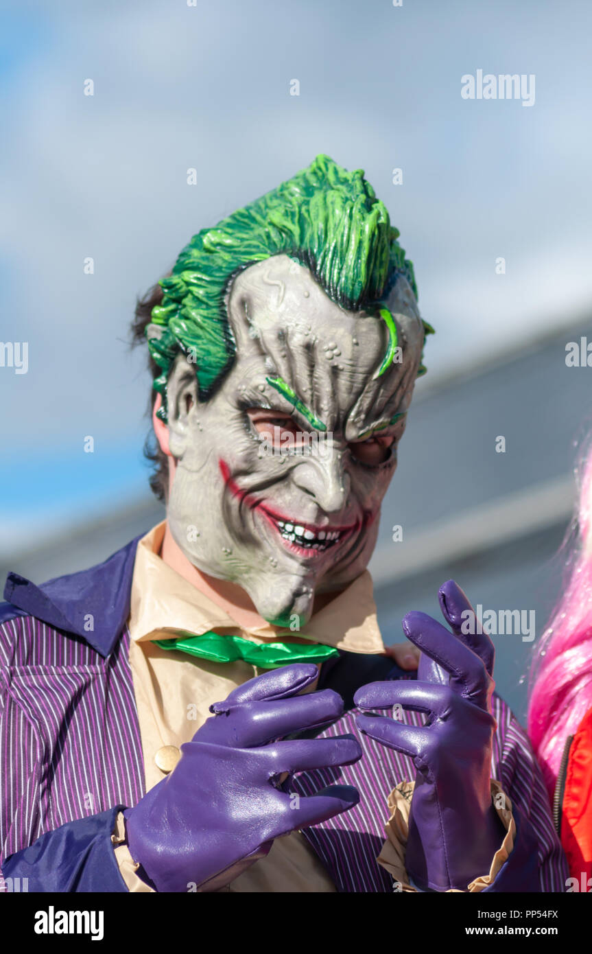 Glasgow, Scotland, UK. 23rd September, 2018. A cosplayer dressed as the fictional supervillain The Joker from the comic books published by DC Comics, arriving on day two of the MCM Scotland Comic Con held at the SEC Centre. Credit: Skully/Alamy Live News Stock Photo