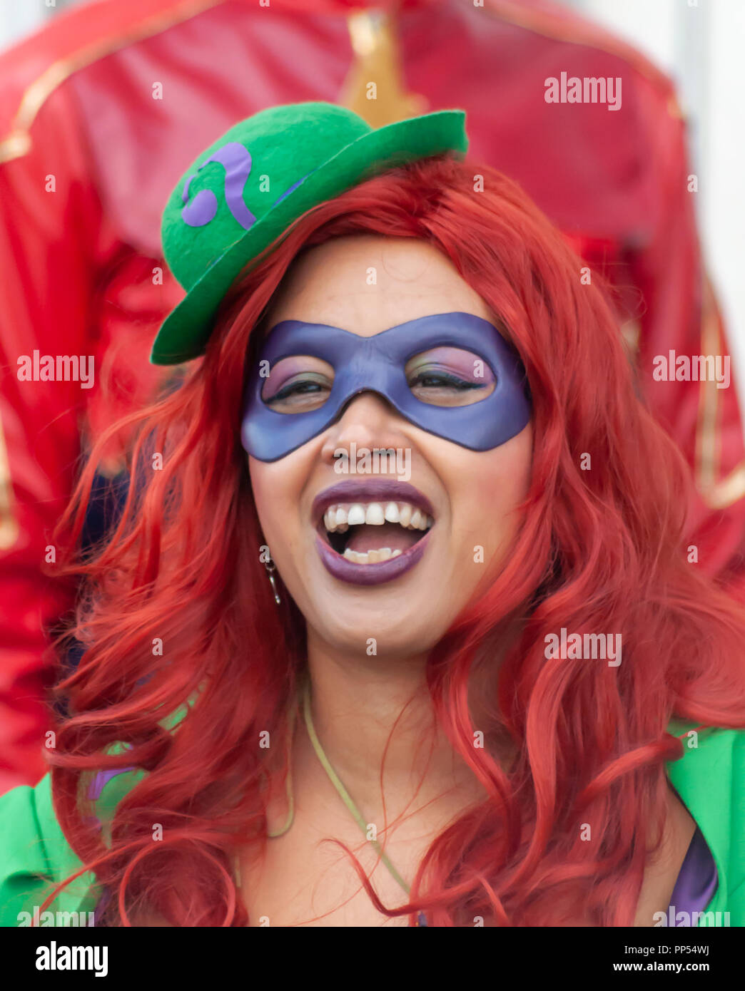 Glasgow, Scotland, UK. 23rd September, 2018. A female cosplayer dressed as  the fictional supervillain The Riddler from the comic books published by DC  Comics, arriving on day two of the MCM Scotland