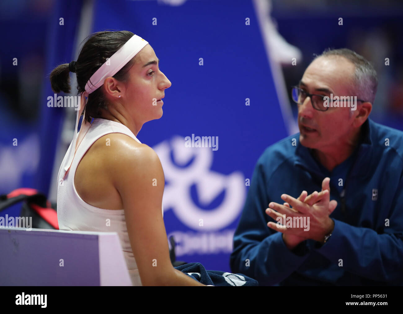 Tokyo, Japan. 21st Sep, 2018. Second seeded Caroline Garcia (L) of France  listens to her coach during the quarter final of the Toray Pan Pacific Open  tennis tournament against Donna Vekic of