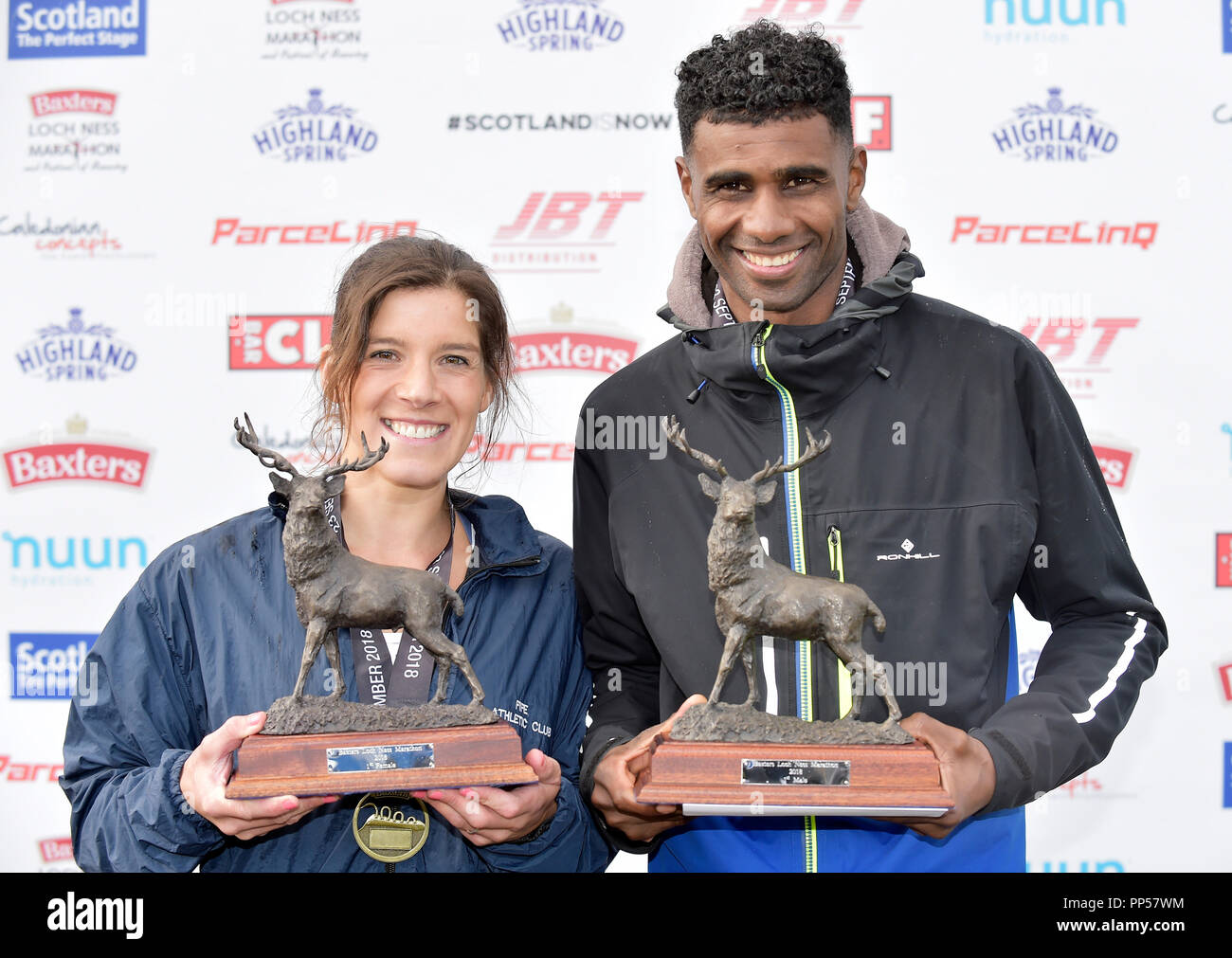 Scotland, UK. 23rd Sept 2018. 2018 Baxters Loch Ness Marathon PICTURED L-R woman winner Sheena Logan from Fife (2.51.11) with the mens winner Mohammad Aburezeq from Altrincham & District AC (02.22.56) Credit: sandy young/Alamy Live News Stock Photo