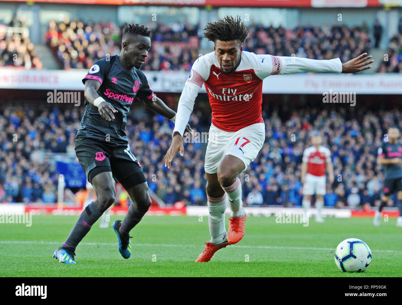 Alex Iwobi of Arsenal and Idrissa Gueye of Everton in action during the Premier League match between Arsenal and Everton at Emirates Stadium on September 23rd 2018 in London, England. (Photo by Zed Jameson/phcimages.com) Stock Photo