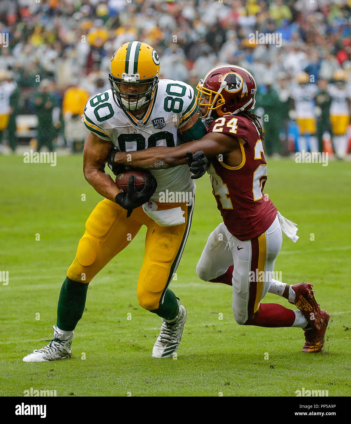 Landover, MD, USA. 23rd Sep, 2018. Washington Redskins CB #24 Josh Norman  tries to drag down Green Bay Packers TE #80 Jimmy Graham during a NFL  football game between the Washington Redskins