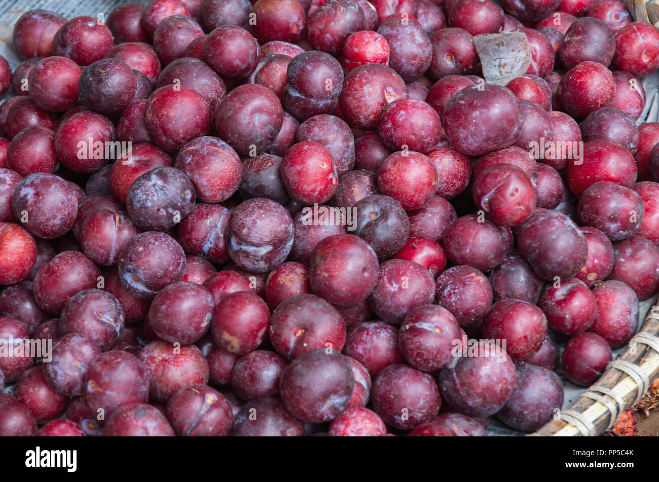 Background with plums fruit in the southeast asia market, picture use for design, advertising, marketing, business and printing Stock Photo