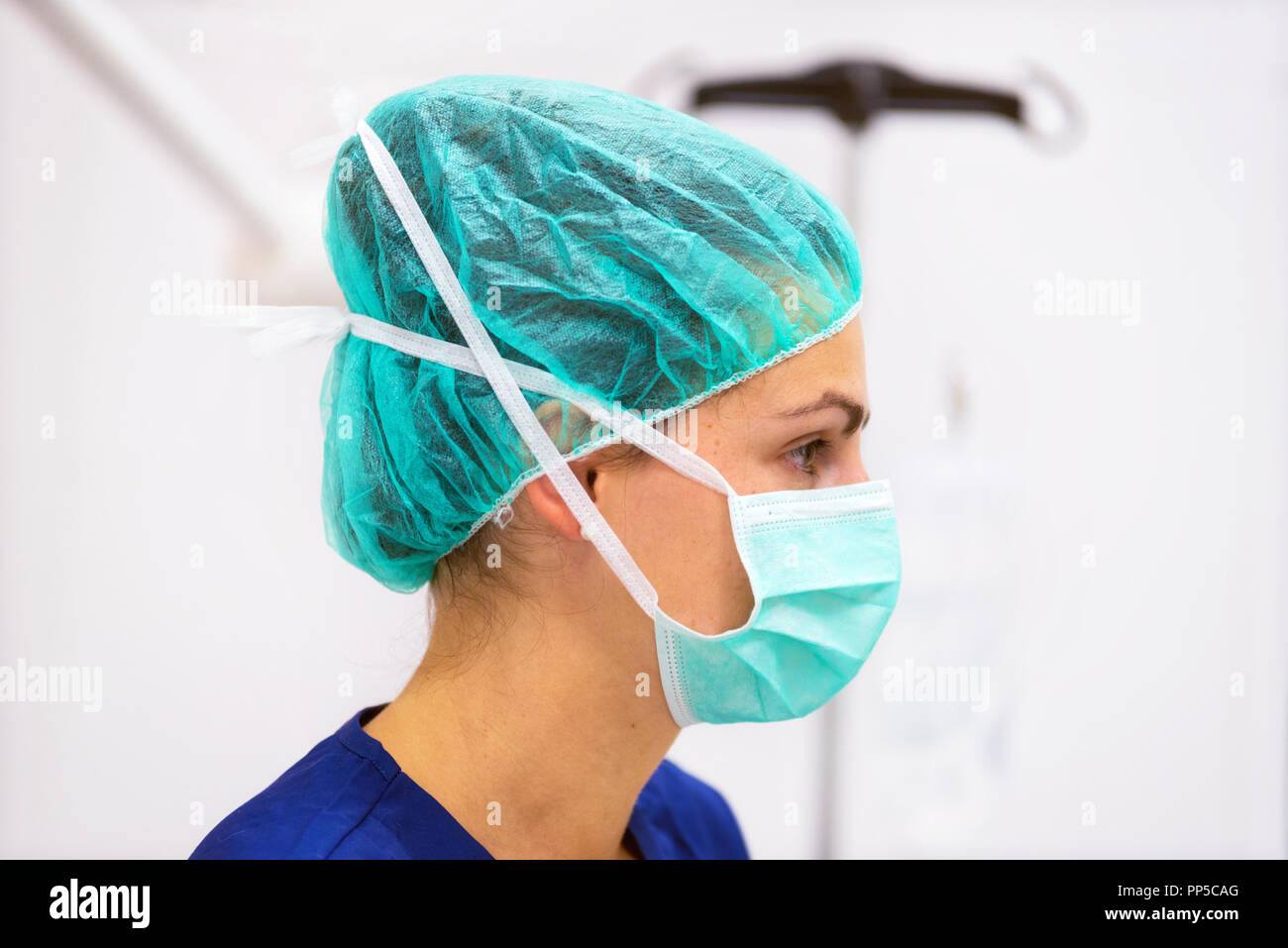 Doctor Portrait With Protective Mask And Hat In Operating