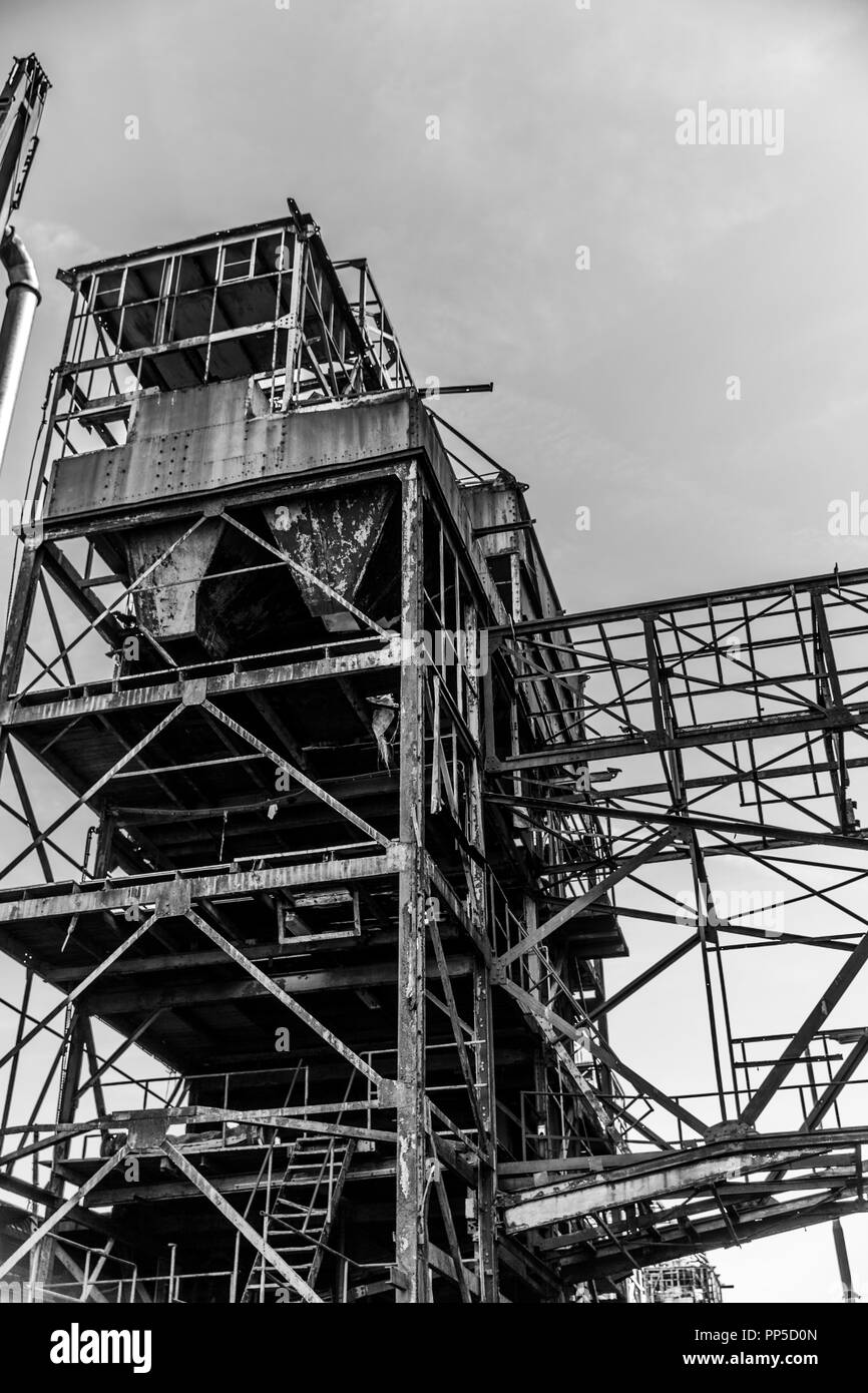 black and white image of the metal structure of an abandoned factory in the city of Rotterdam in the Netherlands Holland Stock Photo