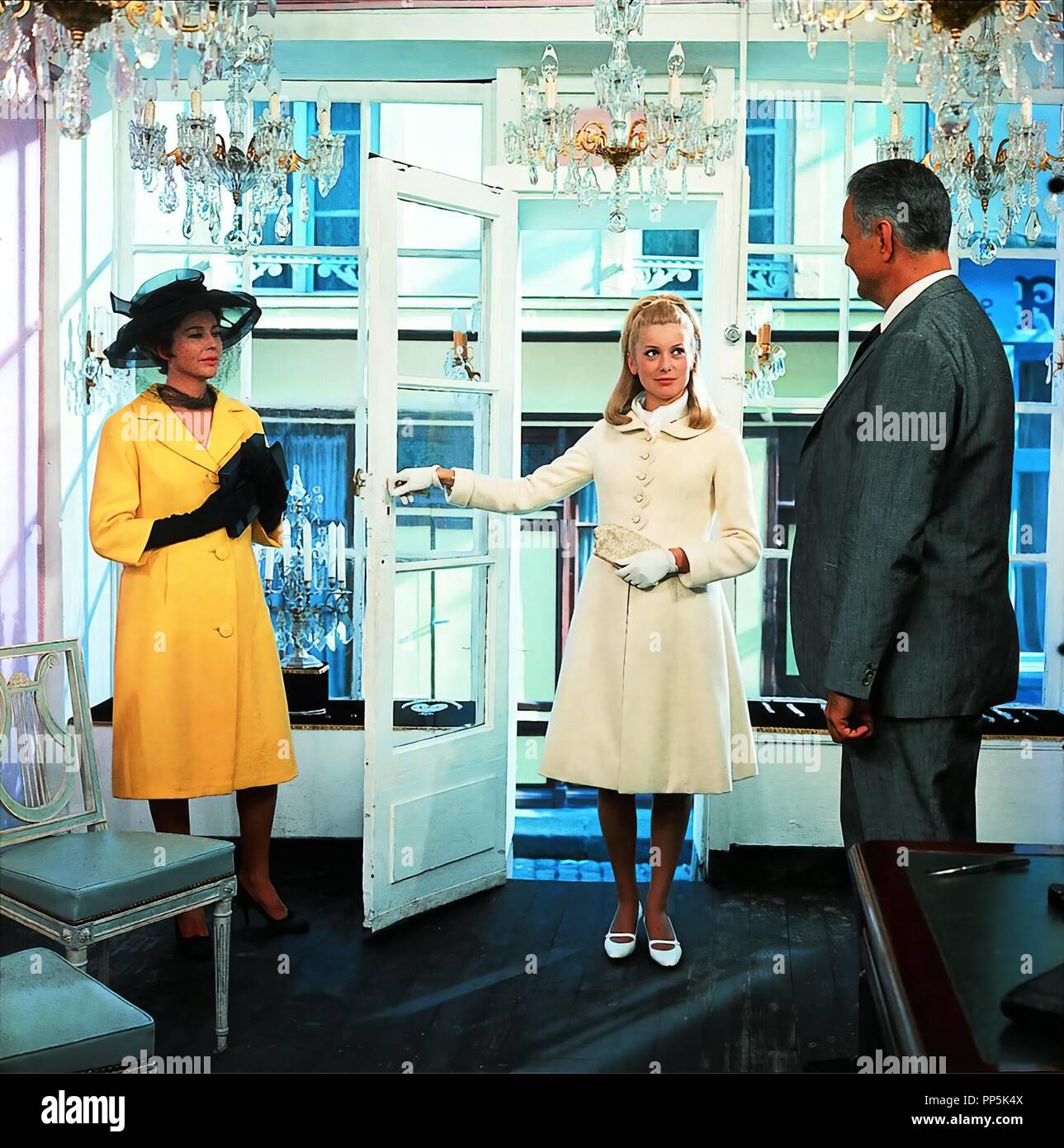 Original film title: LES PARAPLUIES DE CHERBOURG. English title: THE  UMBRELLAS OF CHERBOURG. Year: 1964. Director: JACQUES DEMY. Stars:  CATHERINE DENEUVE. Credit: PARC FILMS / Album Stock Photo - Alamy