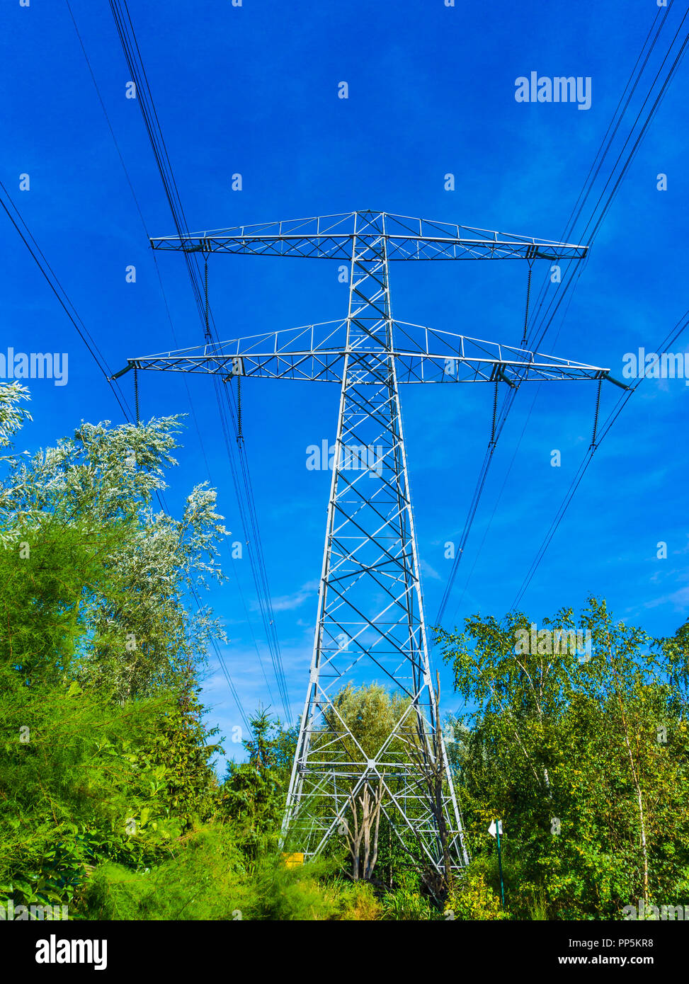 electricity transmission tower with power cables sky line view Stock