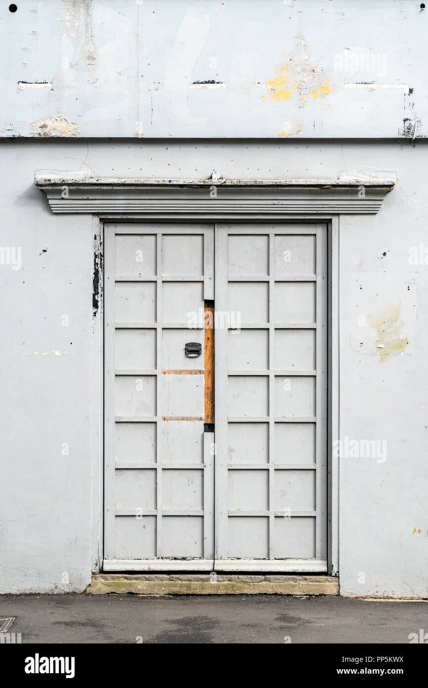 Shabby grey painted doors and wall Stock Photo