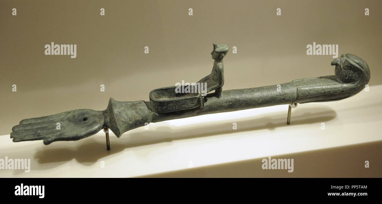 Egyptian censer for burning incense grains in front of a divine shrine. Bronze. 25th Dynasty. Third Intermediate Period. 700 BC. Neues Museum. Berlin. Germany. Stock Photo