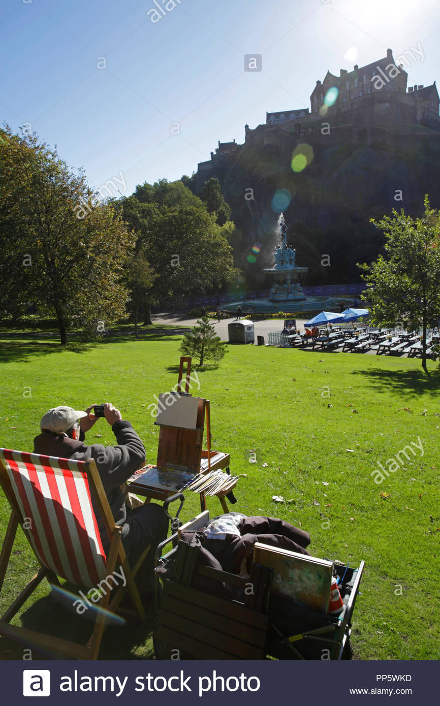 Artist with easel outdoors preparing to paint Edinburgh castle Stock