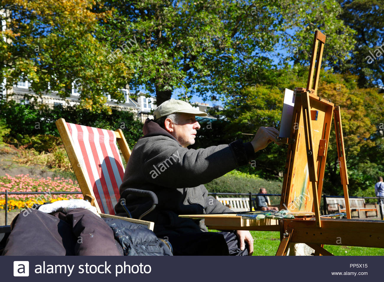 Artist with easel painting in oils outdoors Stock Photo Alamy