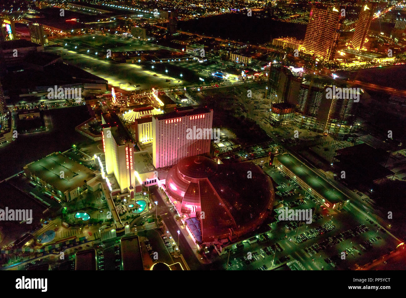 Las Vegas, Nevada, United States - August 18, 2018: aerial view of Las Vegas Strip and Skyline illuminated by night. Scenic flight above: Circus Circus and Downtown of cityscape. Stock Photo