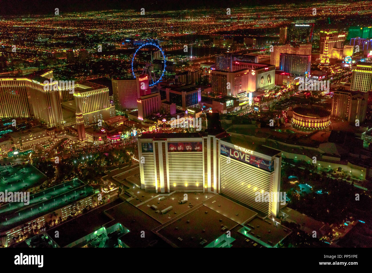 Las Vegas, Nevada, United States - August 18, 2018: aerial view of Las Vegas Strip by night. Scenic flight: High Roller Ferris Whell, The Mirage, Flamingo, Caesars Palace, The Paris, Casino Bellagio. Stock Photo