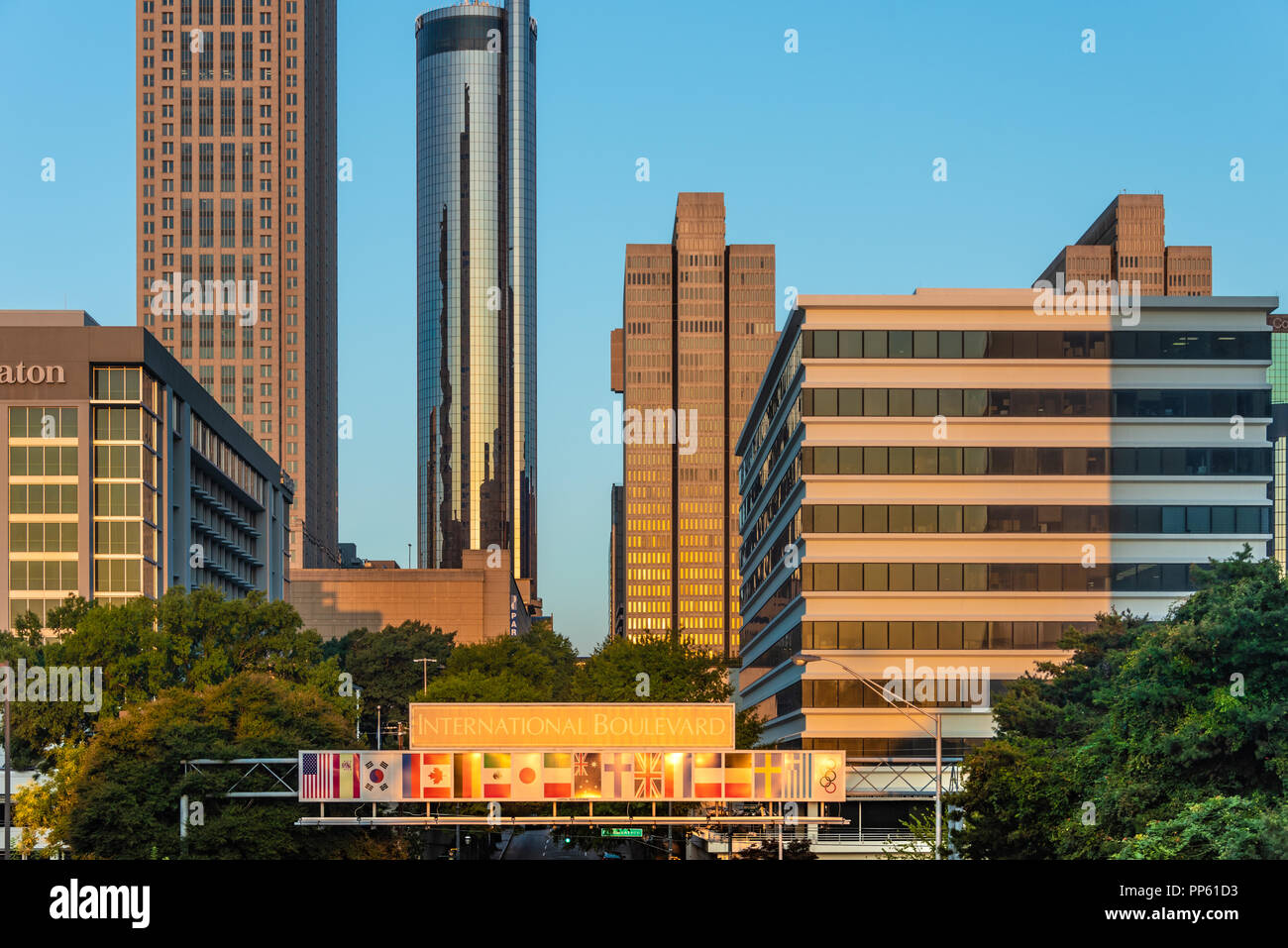The rising sun illuminates downtown Atlanta, Georgia as early morning commuters enter the city on Andrew Young International Boulevard. (USA) Stock Photo