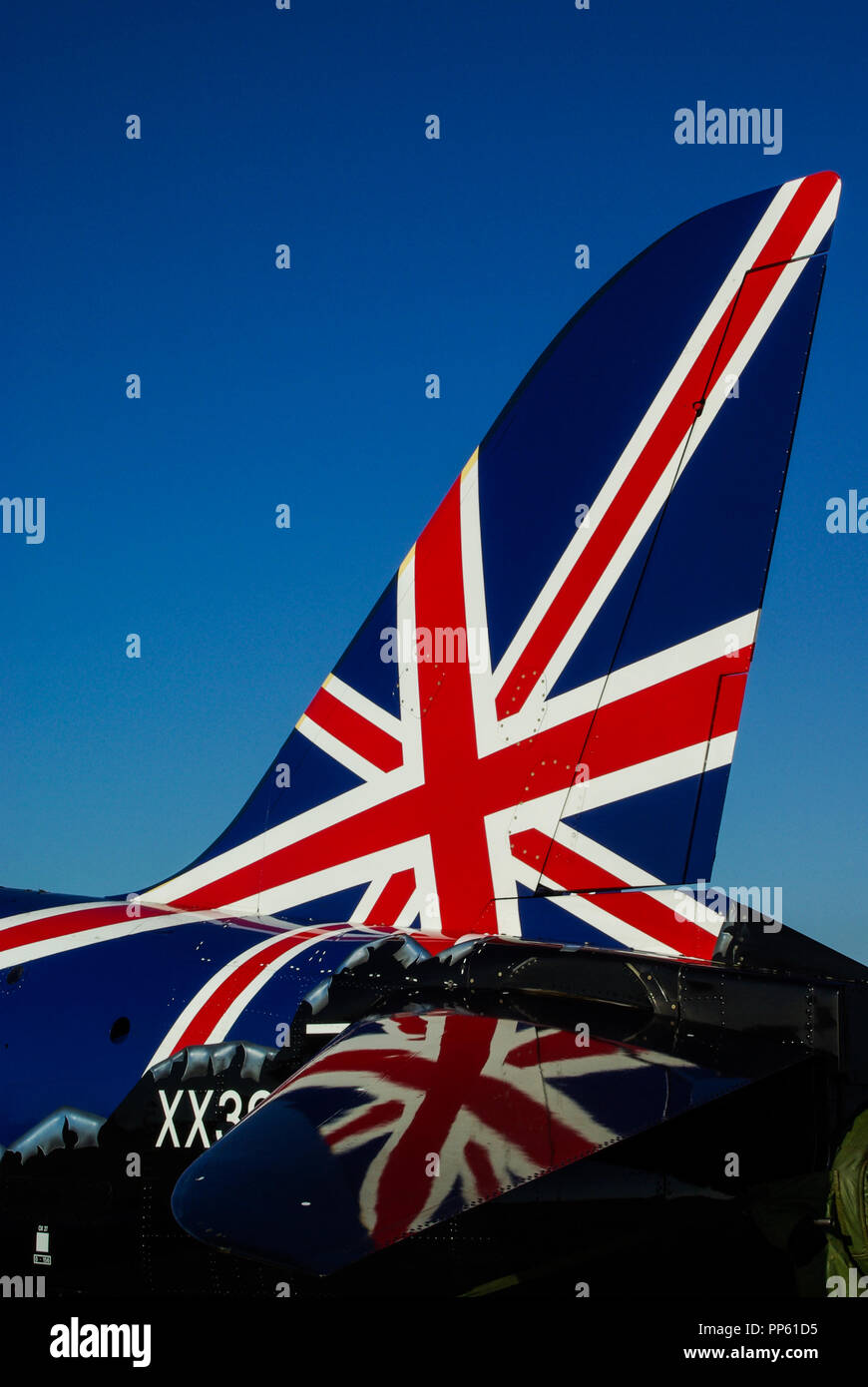 British Union Jack Flag on the tail of a Royal Air Force RAF BAe Hawk T1 jet plane. Reflected on tail plane. Blue sky Stock Photo