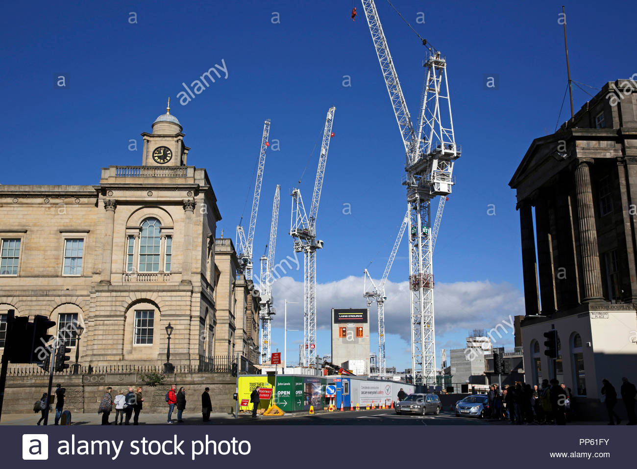 Cranes standing over the St James Centre demolition and redevelopment, view towards Leith Street from Waterloo Place, Edinburgh Scotland Stock Photo