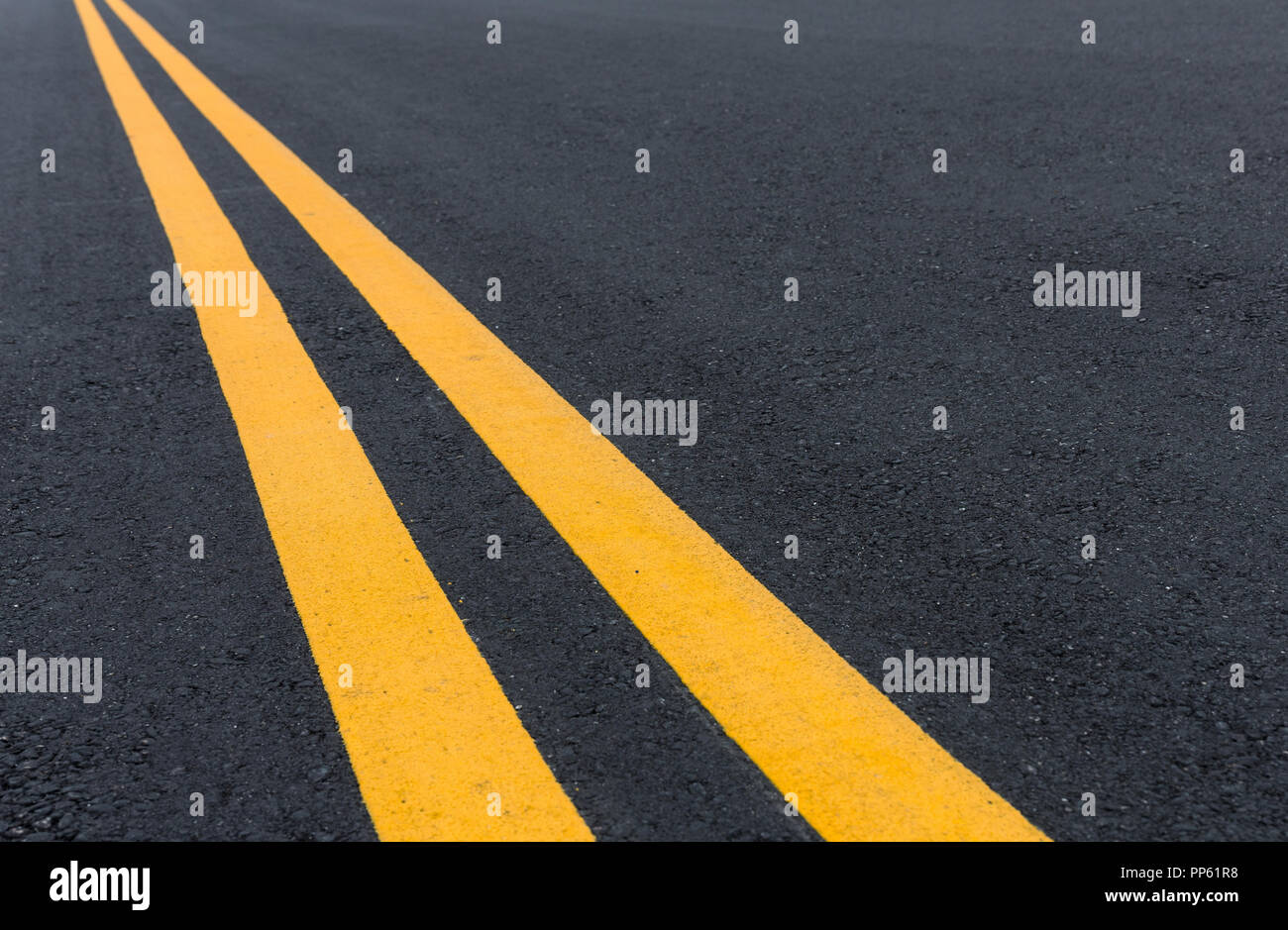 Asphalt road with pair of yellow line Stock Photo - Alamy