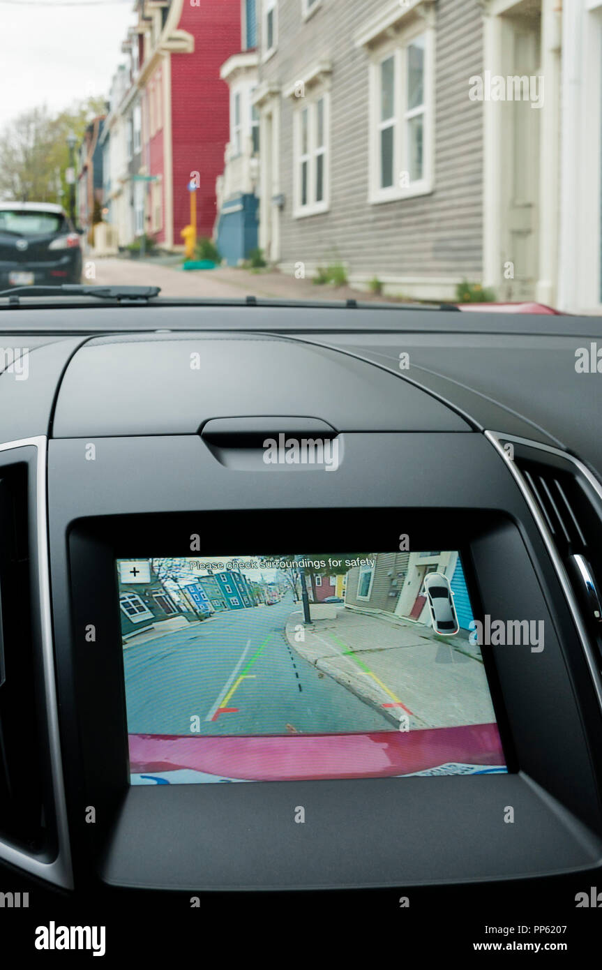 Rear view camera screen of a Ford Edge car. The system activates automatically if reverse gear is selected & uses virtual guidelines to help parkling. Stock Photo