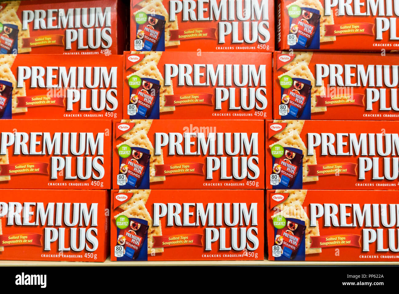 Boxes of Premium Plus crackers for sale on a supermarket shelf. Stock Photo