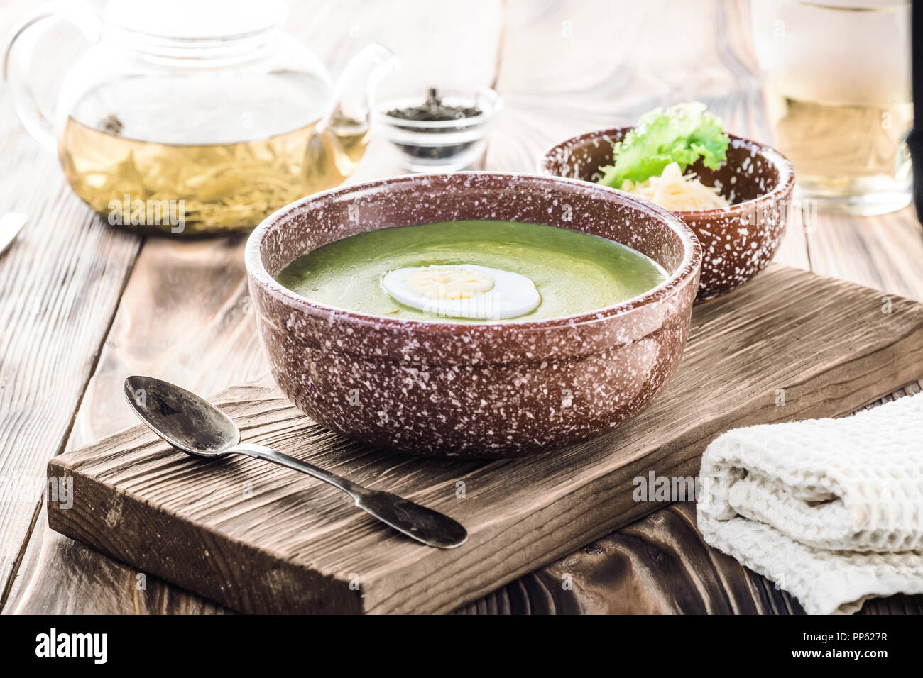 Puree cream soup of green leaf lettuce, spinach and cheese Stock Photo