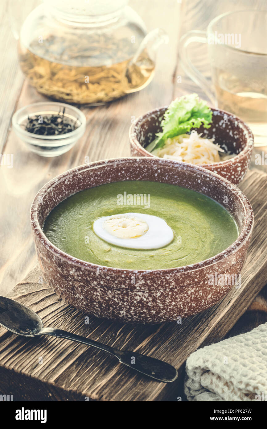 Puree cream soup of green leaf lettuce, spinach and cheese Stock Photo