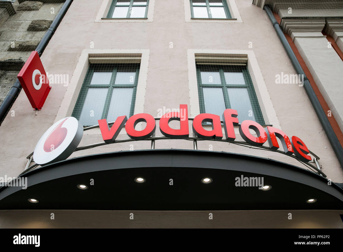 A logo sign outside of a Vodafone retail store in Munich, Germany, on September 2, 2018. Stock Photo