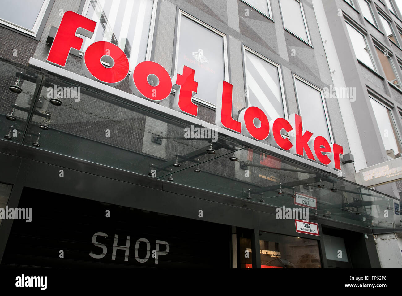 A logo sign outside of a Foot Locker retail store in Munich, Germany, on September 2, 2018. Stock Photo
