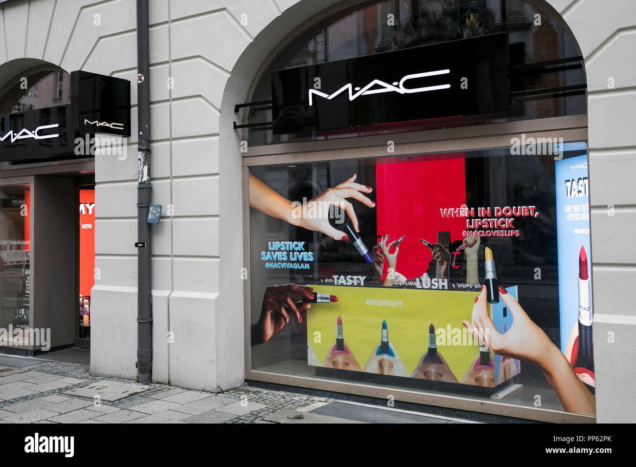 A logo sign outside of a MAC Cosmetics retail store in Munich, Germany, on September 2, 2018. Stock Photo