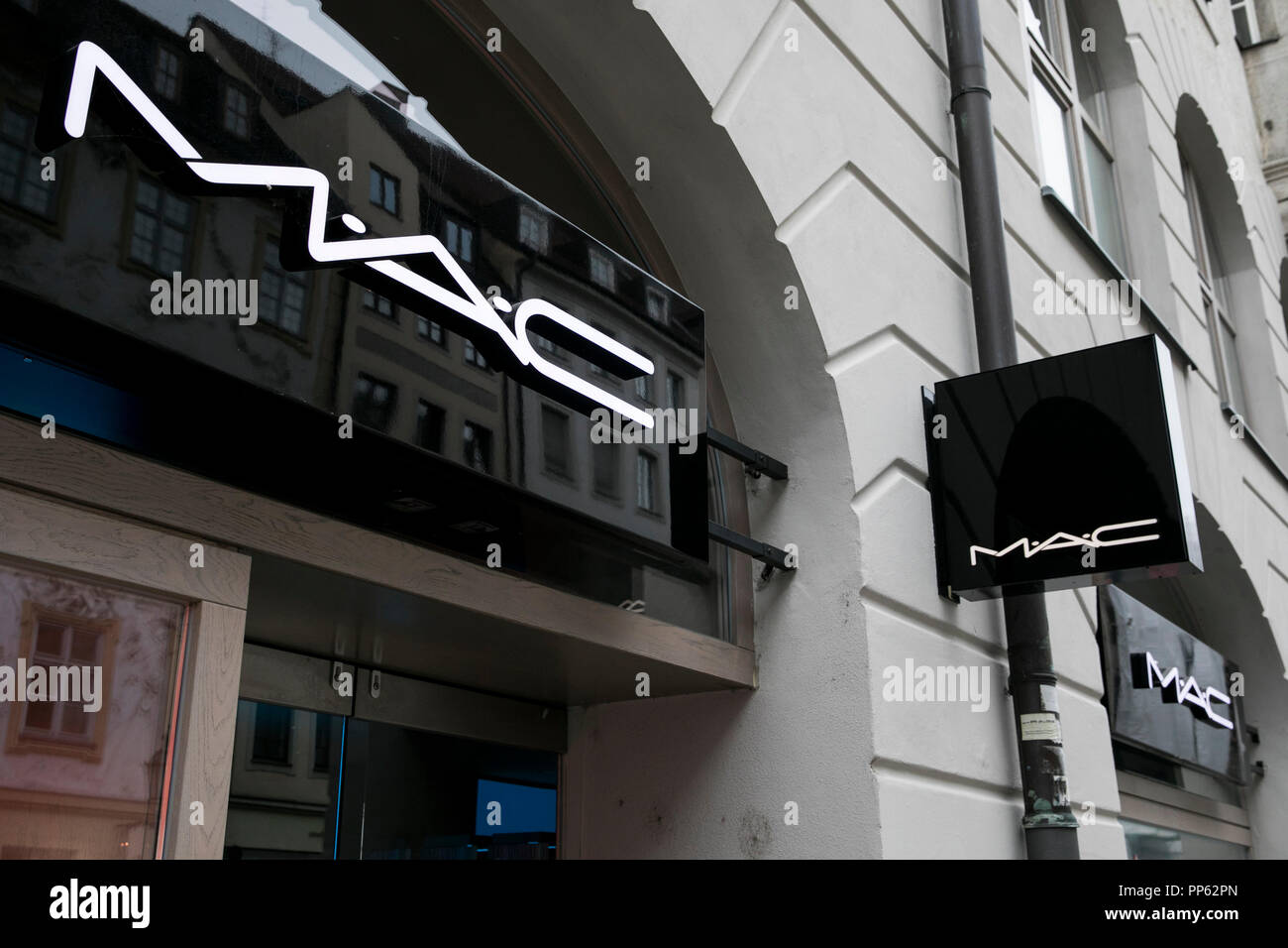 A logo sign outside of a MAC Cosmetics retail store in Munich, Germany, on September 2, 2018. Stock Photo