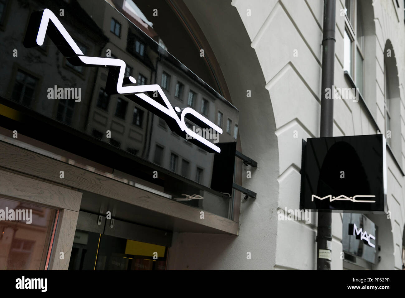 A logo sign outside of a MAC Cosmetics retail store in Munich, Germany, on September 2, 2018. Stock Photo