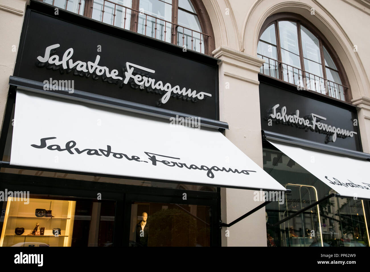 A logo sign outside of a Salvatore Ferragamo retail store in Munich, Germany, on September 2, 2018. Stock Photo