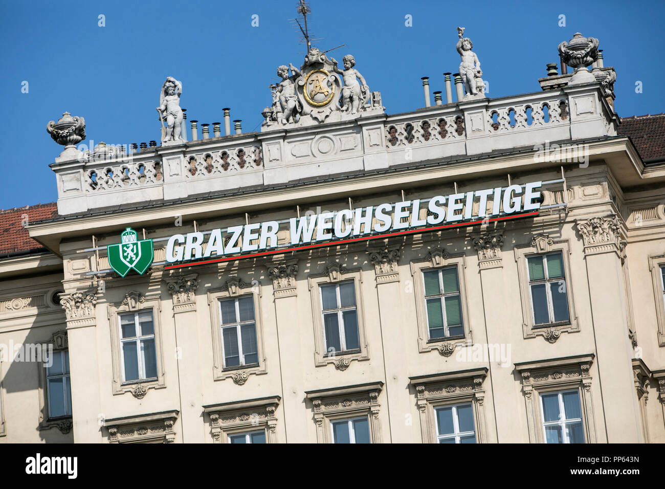 A logo sign outside of a facility occupied by Grazer Wechselseitige Versicherung or Graz Mutual Insurance Company, in Vienna, Austria, on September 6, Stock Photo