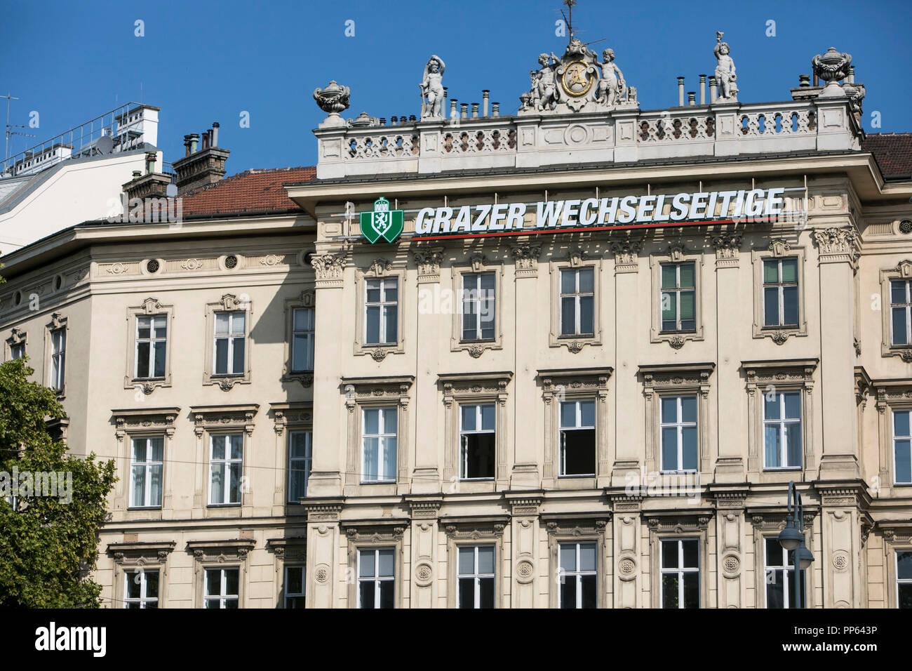 A logo sign outside of a facility occupied by Grazer Wechselseitige Versicherung or Graz Mutual Insurance Company, in Vienna, Austria, on September 6, Stock Photo