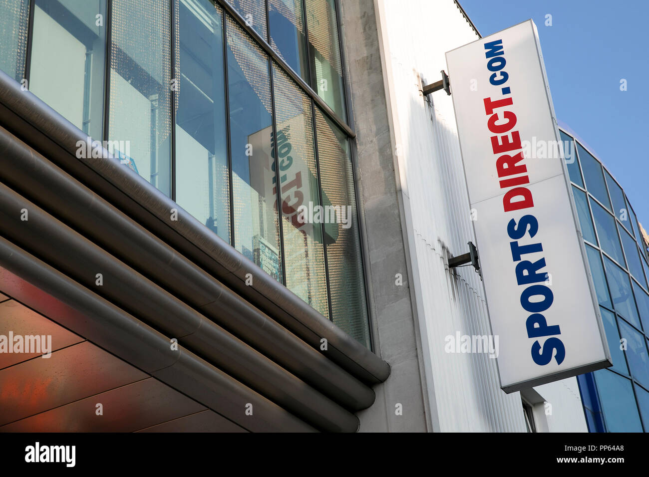 A logo sign outside of a Sports Direct International retail store in