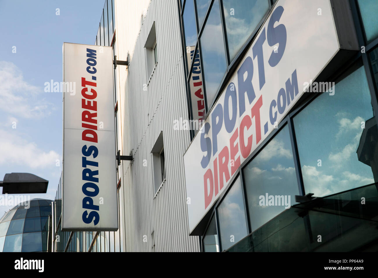 A logo sign outside of a Sports Direct International retail store in