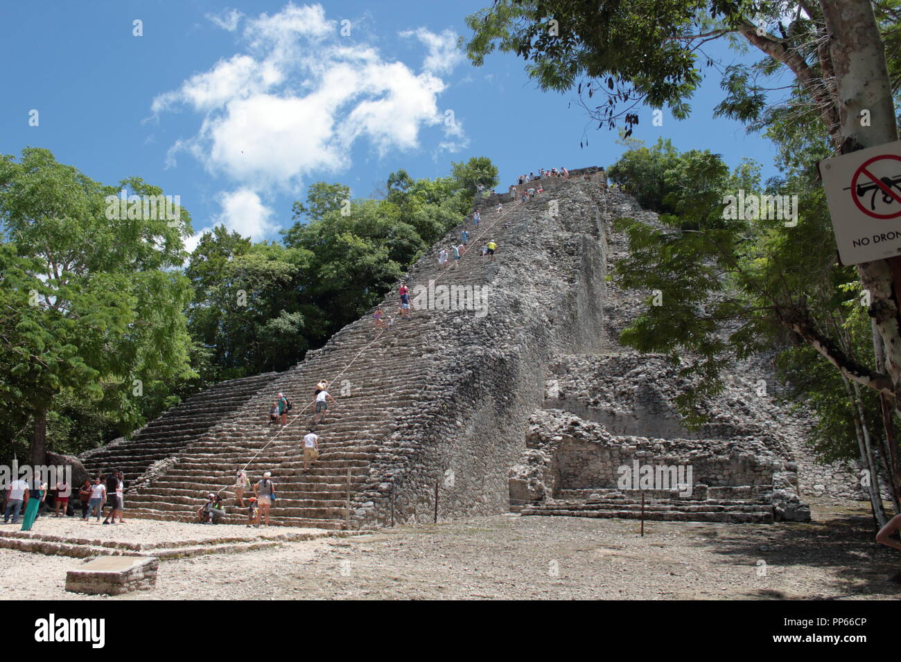 tourists who visit the archaeological site of Coba in Mexico with its beautiful 45-meter-high pyramid where climbing is at the risk of the tourist him Stock Photo