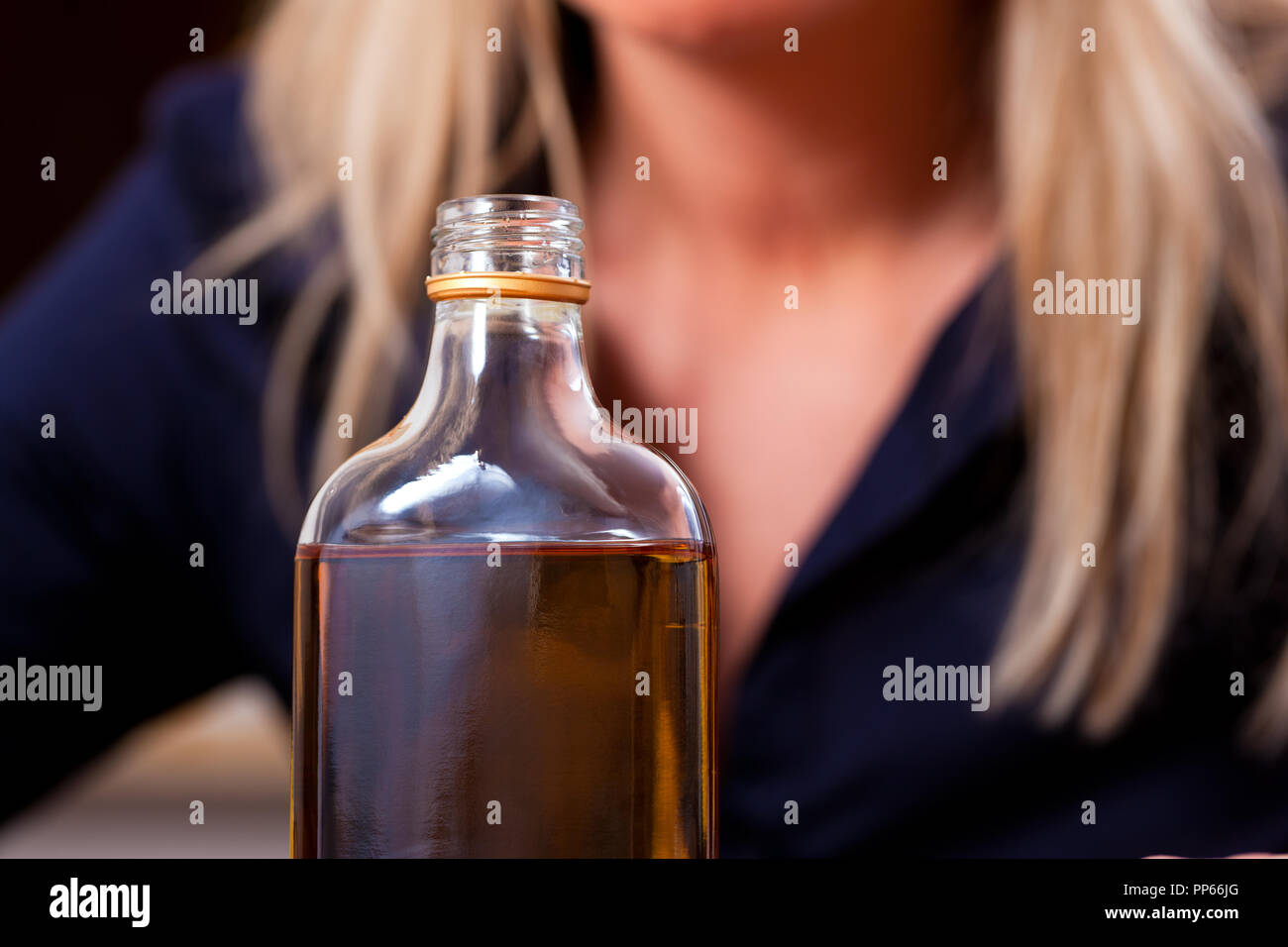 A Girl with a Bad Appearance Holds a Bottle of Alcohol Near Her Head. on a  Gray Background. Stock Image - Image of girl, excitement: 106671949