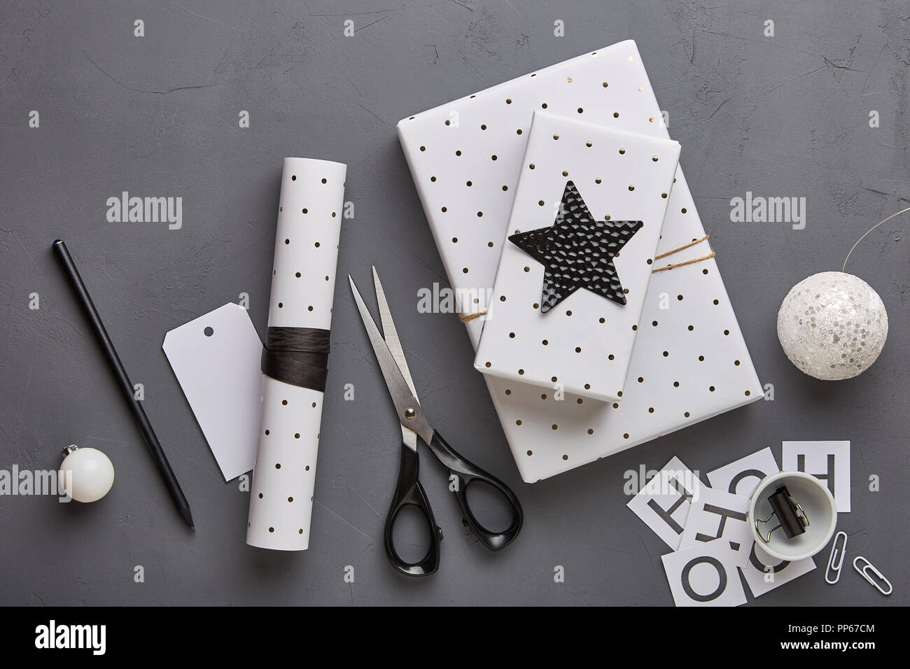 Placeit - Wrapping Paper Mockup with Scissors and Gift Items Above