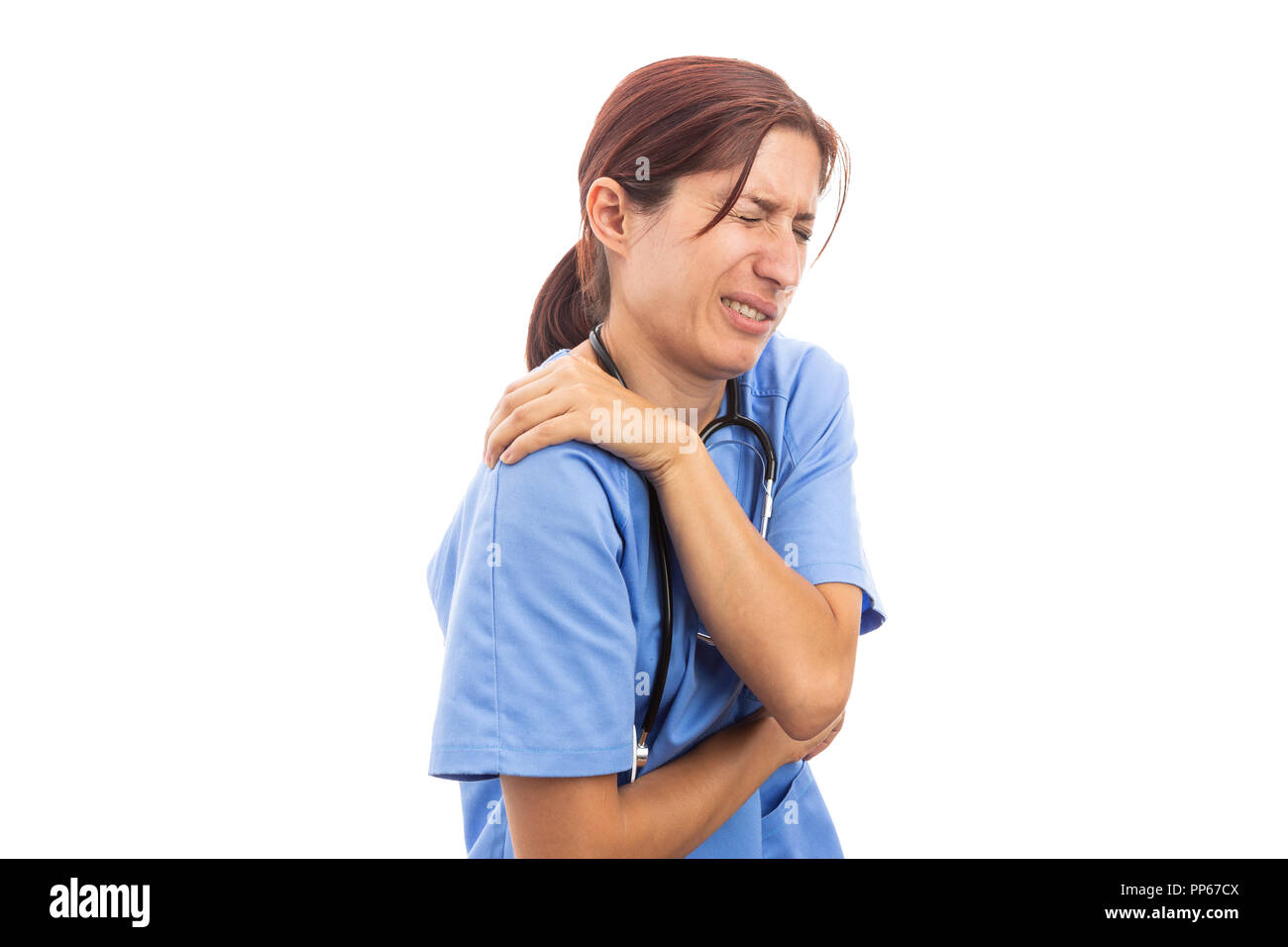 Injured hospital woman nurse or doctor holding painful shoulder and upset expression as clinic