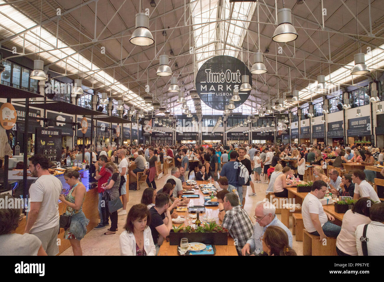 Inside Time Out Market Lisbon with diverse food stalls and vibrant atmosphere