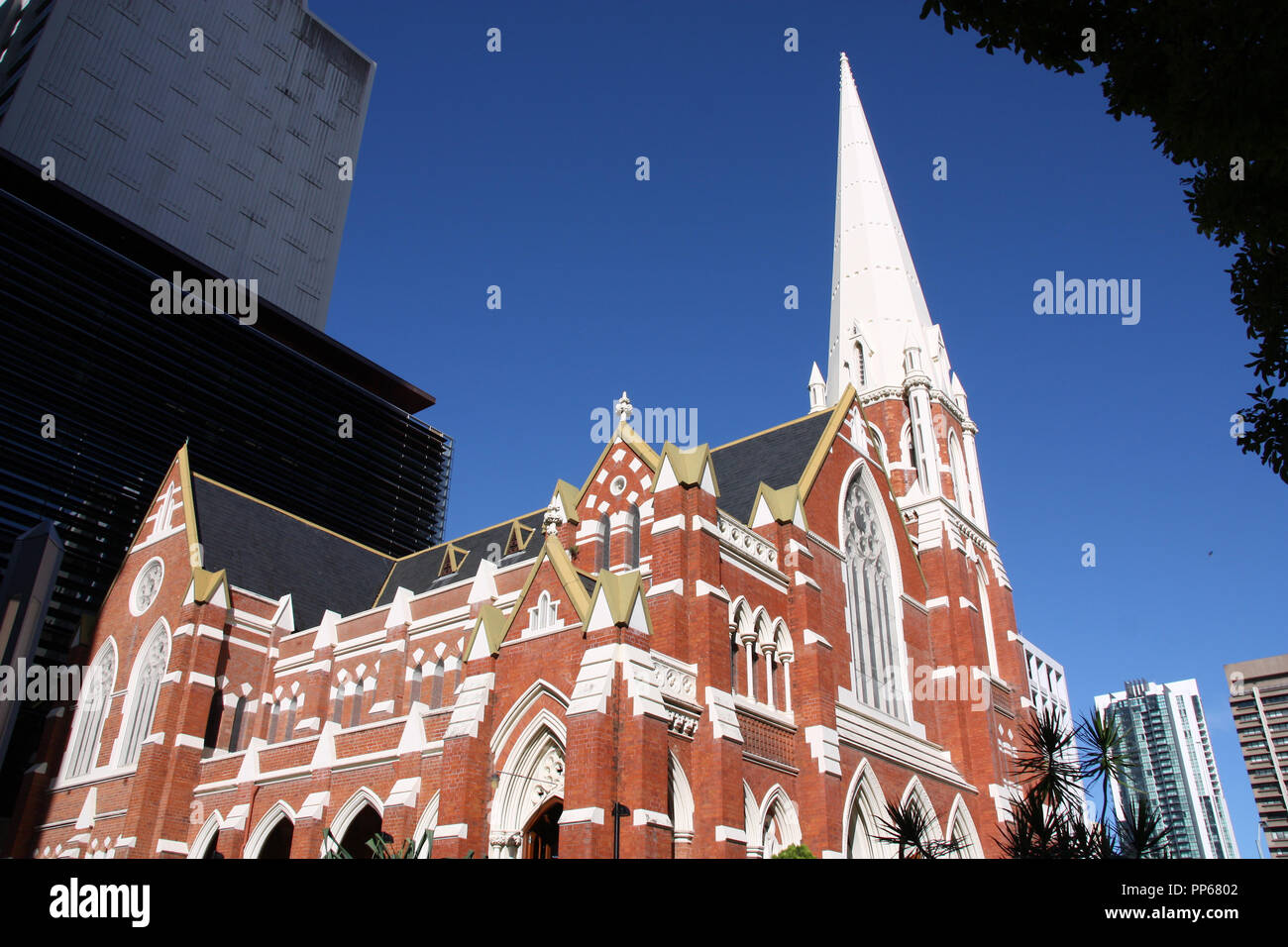Albert Street Church surrounded by skyscrapers in Brisbane, Queensland, Australia. Stock Photo