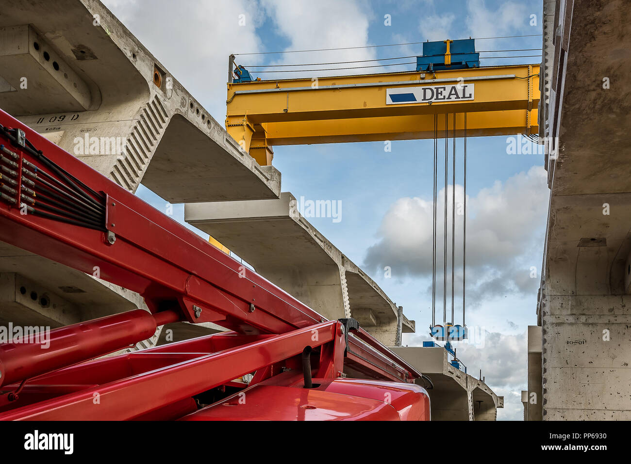 Crane lifting a concrete element at The Crown Princess Mary Bridge, a construction site in Fredrikssund, Denmark, September 23, 2018 Stock Photo