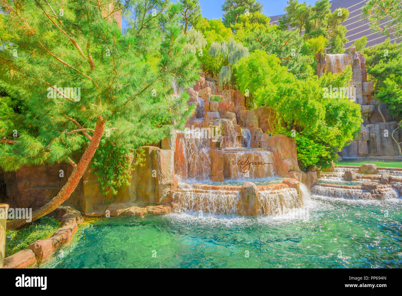 Las Vegas, Nevada, United States - August 18, 2018: closeup of Wynn Las Vegas Waterfall Fountain in the garden outdoors in blue sky day. The Wynn is Resort Hotel Casino 5-star, Las Vegas Strip. Stock Photo