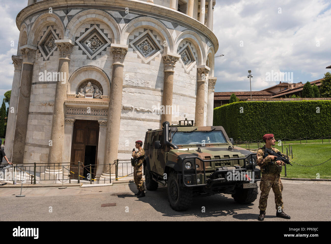 Armoured vehicle and soldiers with automatic rifles to protect public in case of terrorist atttck,  Pisa, Tuscany, Italy Stock Photo